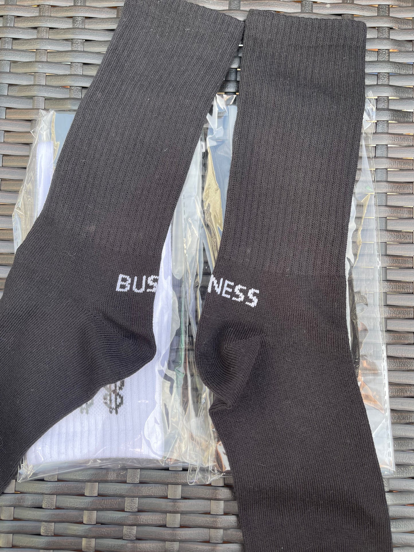 Standing on “BUSINESS” Socks